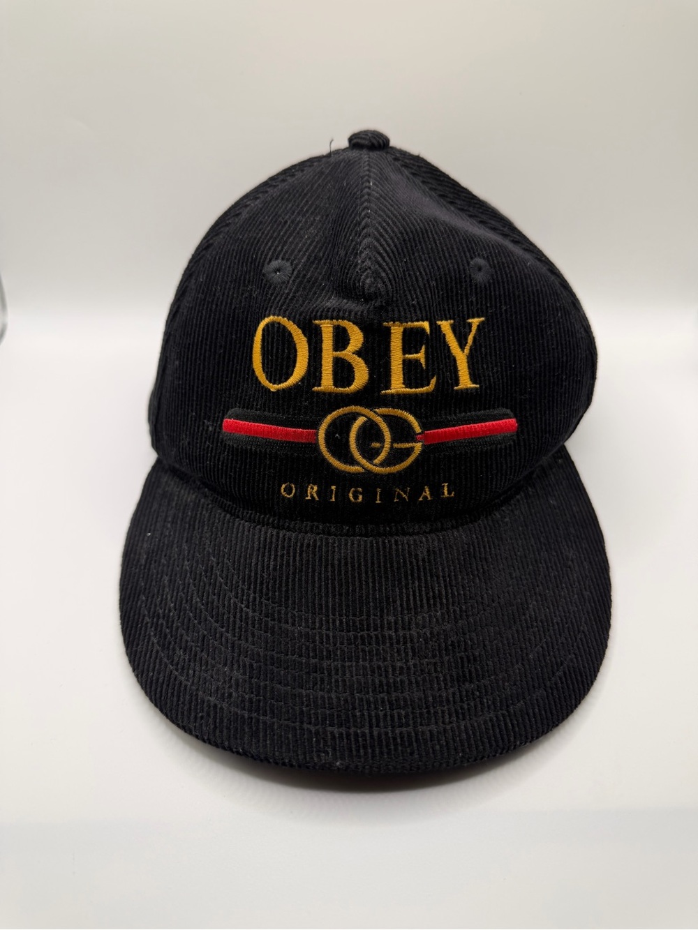 Obey Black Corduroy Cap with Gold Embroidery and Red Accent